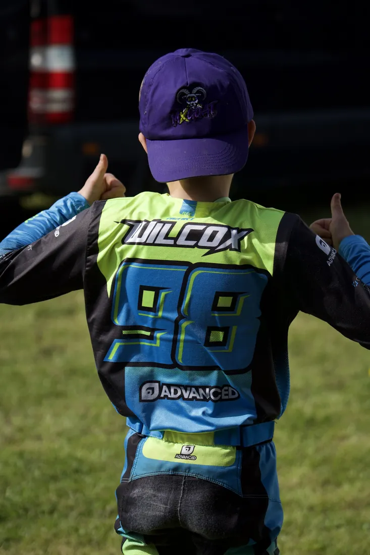 Henry Wilcox giving two thumbs up, WILCOX 98 on his back